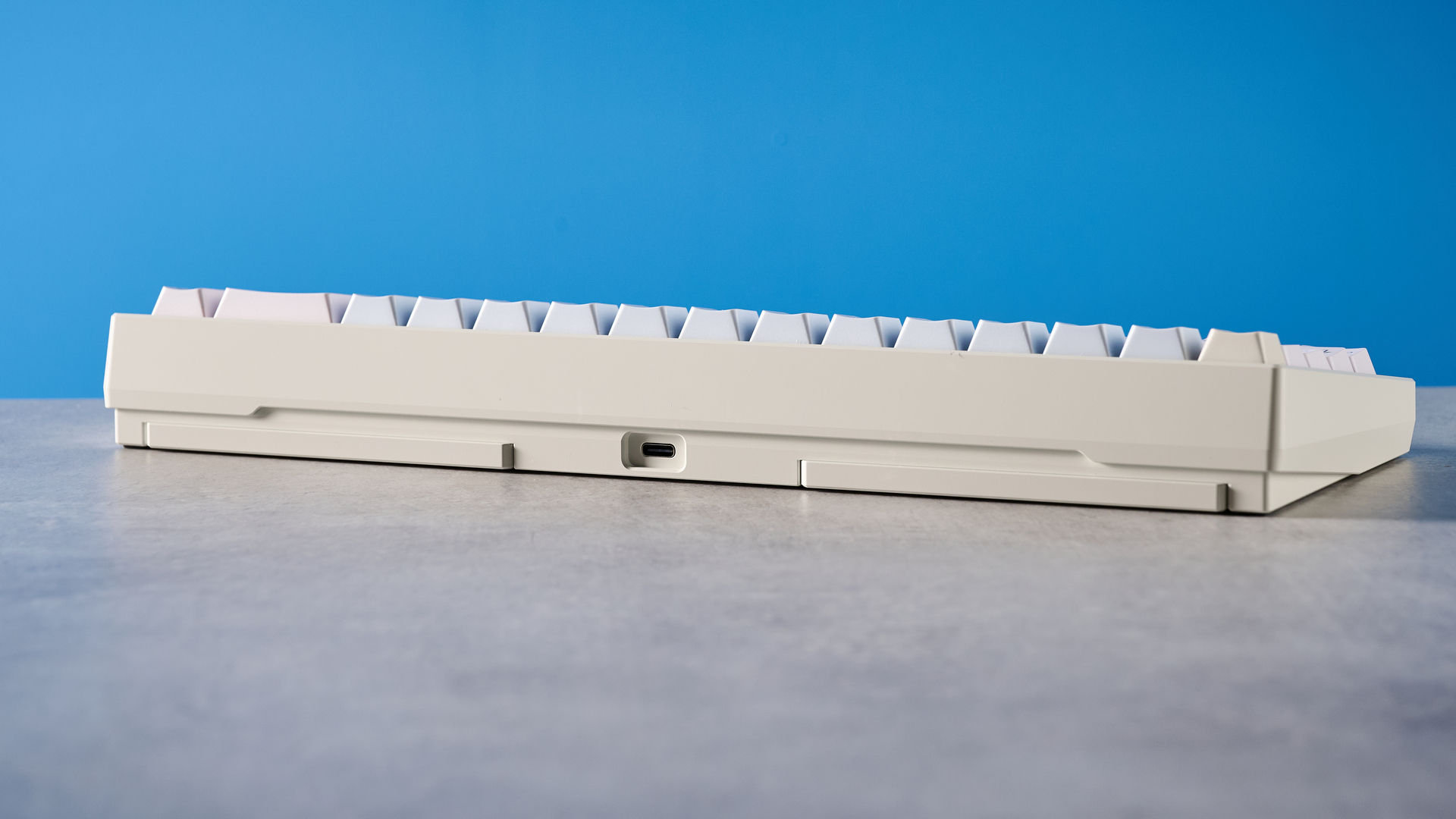 Wobkey Zen 65 mechanical keyboard photographed in front of a blue background