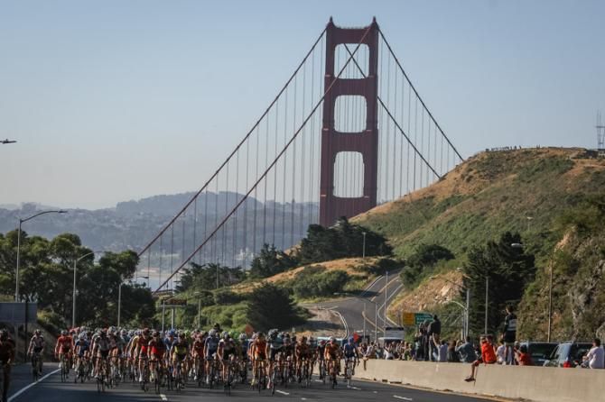 The peloton heads away from the Golden Gate Bridge.