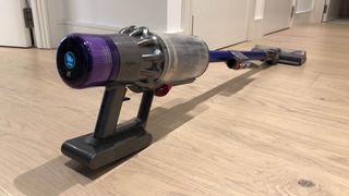 The Dyson V11 vacuum cleaner on a wooden floor