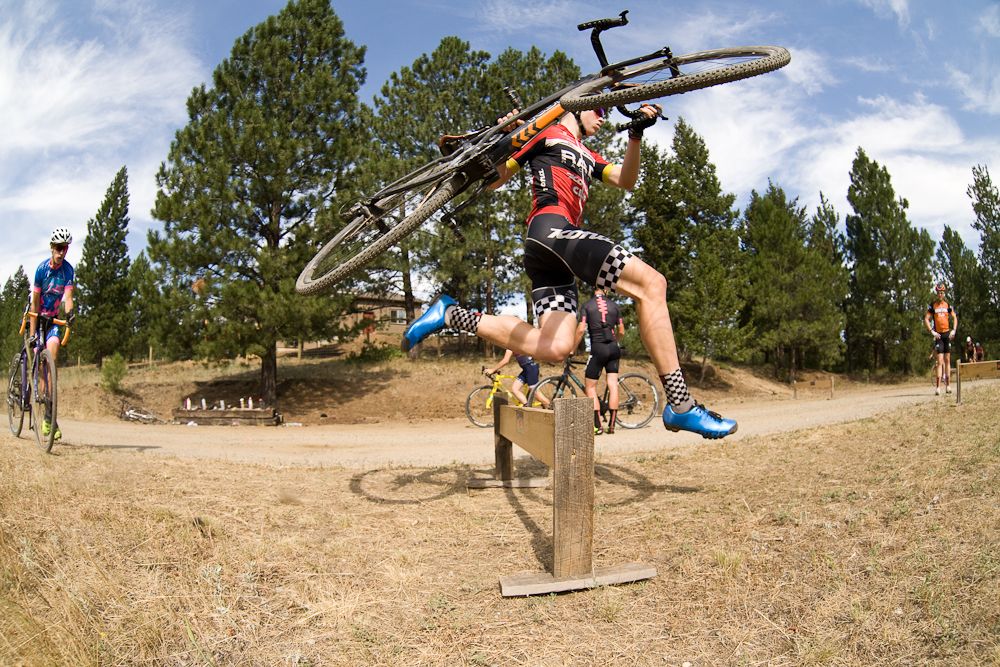 A rider sails over a barrier at Montana Cross Camp