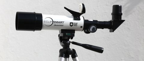 Celestron EclipSmart Travel Solar Scope 50 solar telescope on a tripod in front of a white wall