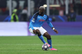 Tanguy Ndombele of Napoli controls the ball during the UEFA Champions League quarterfinal first leg match between AC Milan and SSC Napoli at Giuseppe Meazza Stadium on April 12, 2023 in Milan, Italy.