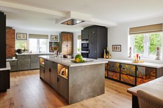 Kitchen with central island, textured and metallic finish cabinets and white walls