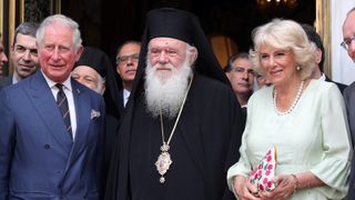 Prince Charles and Camilla, Duchess of Cornwall pose for a photograph with His Beatitude Archbishop Ieronymos II of Athens and All Greece