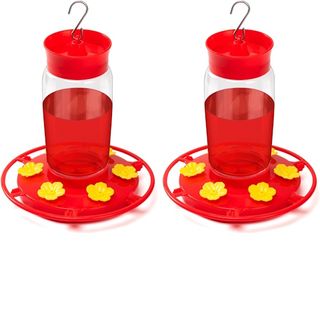 Pair of red hummingbird feeders with yellow flowers