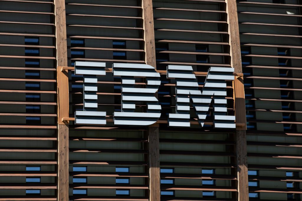 the IBM logo on the outside of local headquarters in Milan, Italy