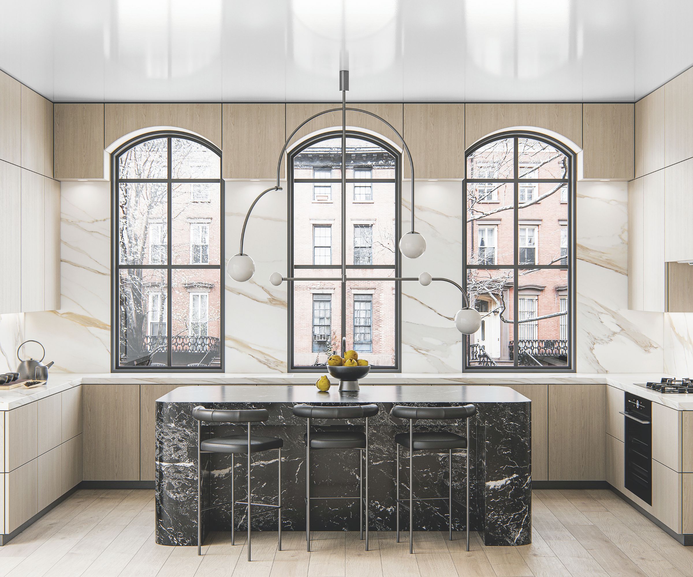 Bright kitchen with pale wooden cabinets and black marble island