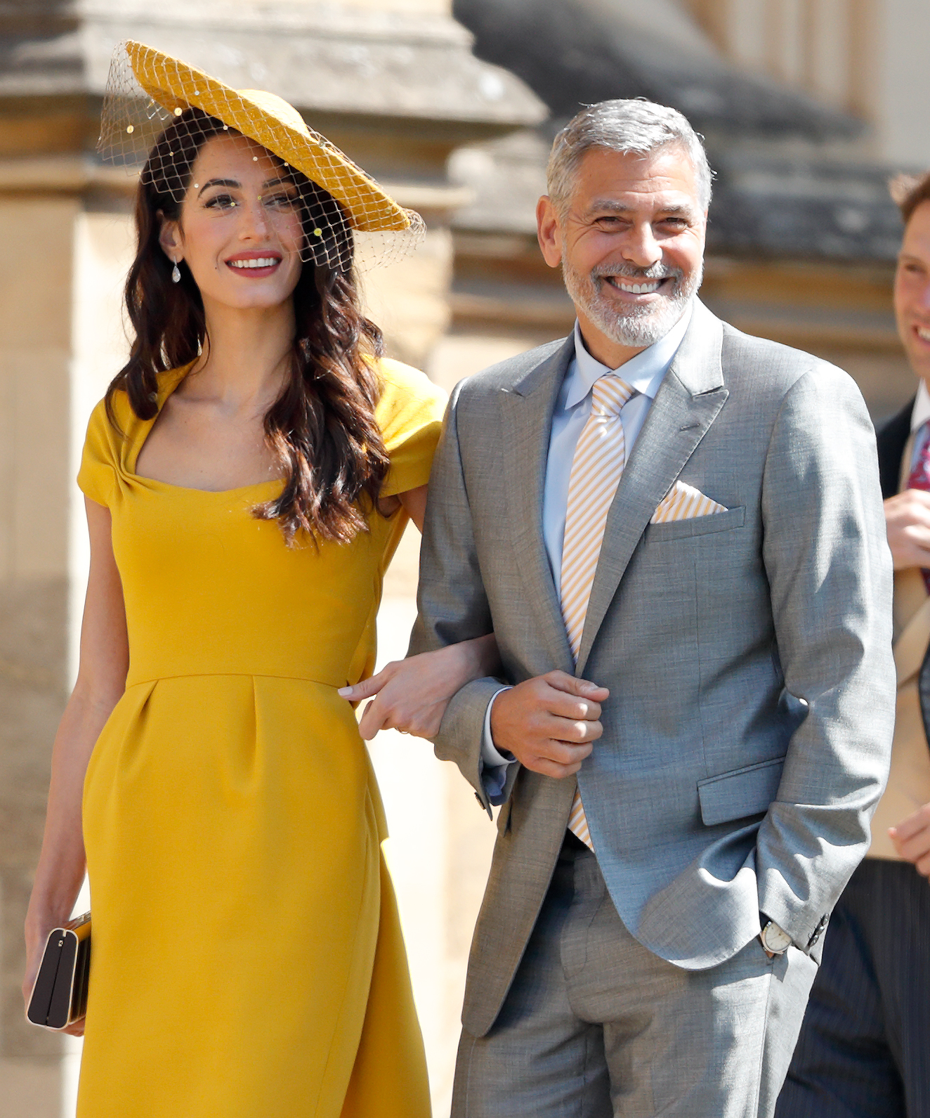 Amal Clooney and George Clooney attending Harry and Meghan's wedding in 2018
