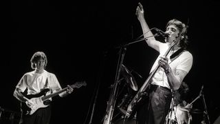 Roger Waters and Eric Clapton playing live in 1984