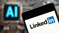 In this photo illustration, the business and employment-oriented network and platform owned by Microsoft, LinkedIn, logo seen displayed on a smartphone with an Artificial intelligence (AI) chip and symbol in the background.