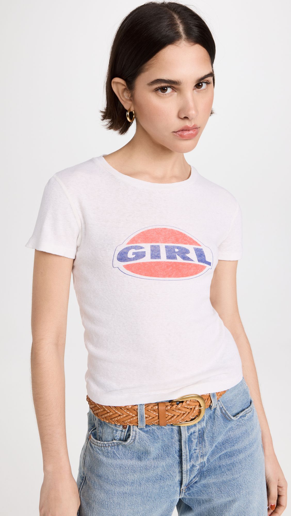 a model wears a white T-shirt with the word