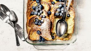 French toast in glass dish with blueberries