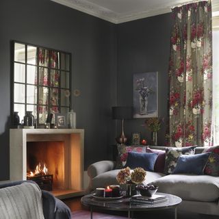 living room with dark grey wall and fireplace