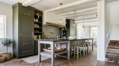 country style kitchen with herringbone floors and olive green kitchen cabinets