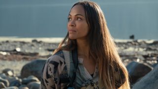 Zoe Saldana looks up with caution in The Adam Project.