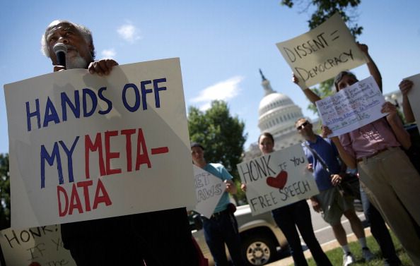 Protesters speak out against the NSA&amp;#039;s collection of phone metadata.