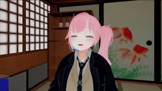 A pink-haired 3D avatar of an anime girl with a pleased face. she is sitting in a virtual room modeled after a Japanese home with shelves in the background.