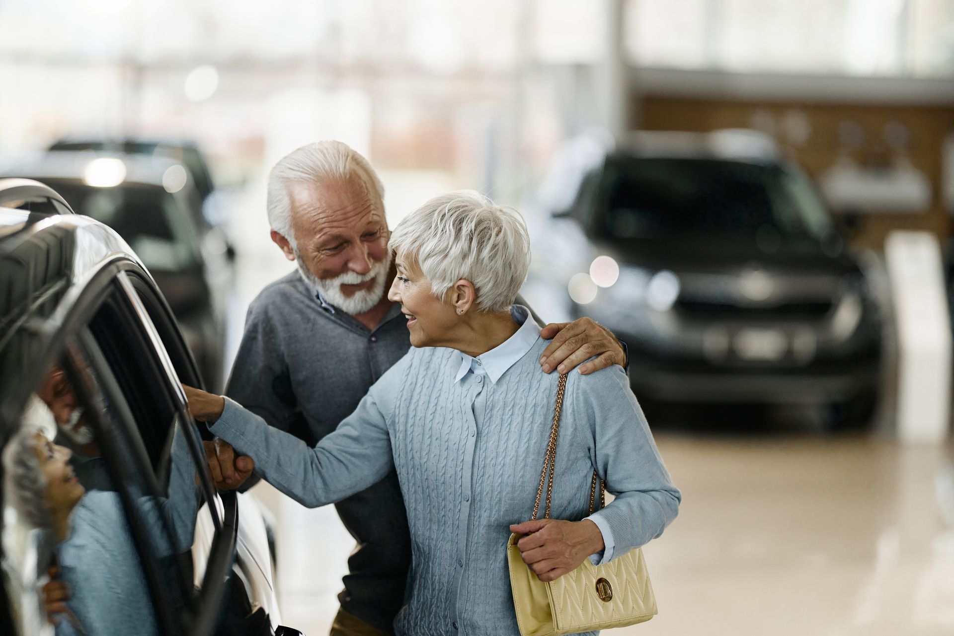 Older couple buying a car