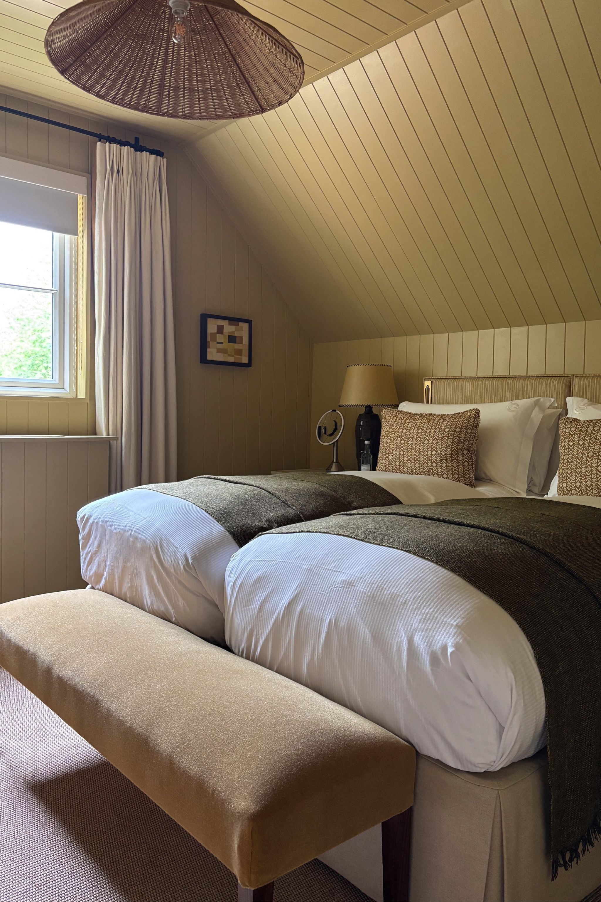 a yellow bedroom with beadboard panelling