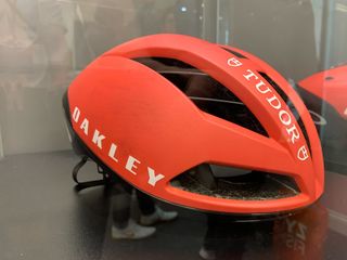 New Oakley Helmets in red pictured in glass case