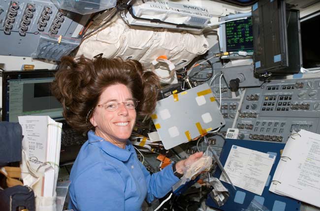 Astronaut Barbara Morgan, an STS-118 mission specialist and former Idaho schoolteacher, smiles for a photo near the aft flight deck of Space Shuttle Endeavour while docked with the International Space Station.