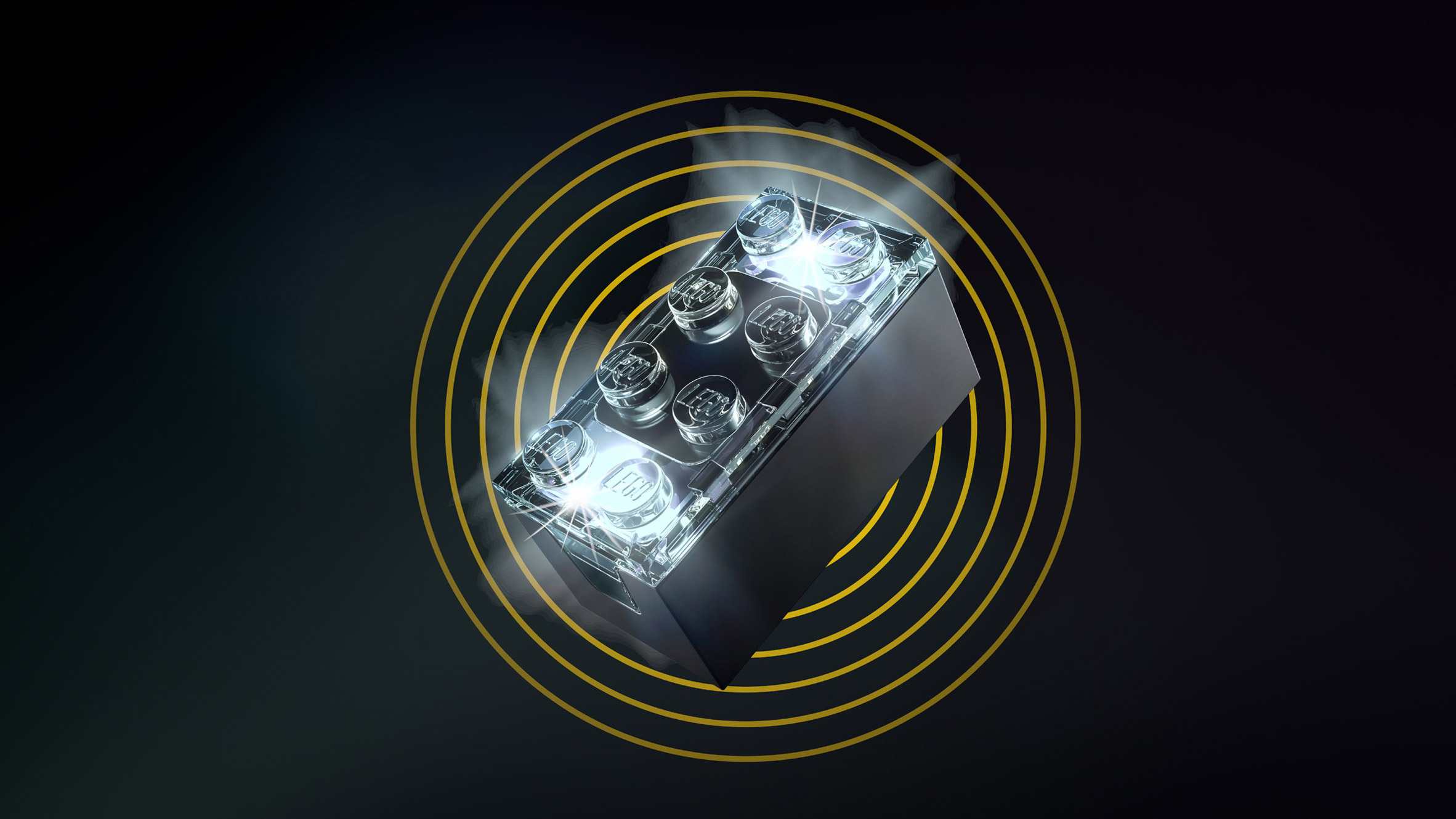 A black LEGO Smart Play brick, glowing and set against a black backdrop. 