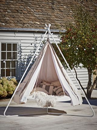 hanging tent with outdoor living room and tree