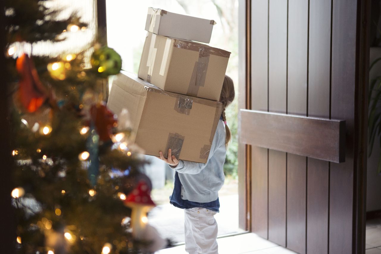 child receiving big packages