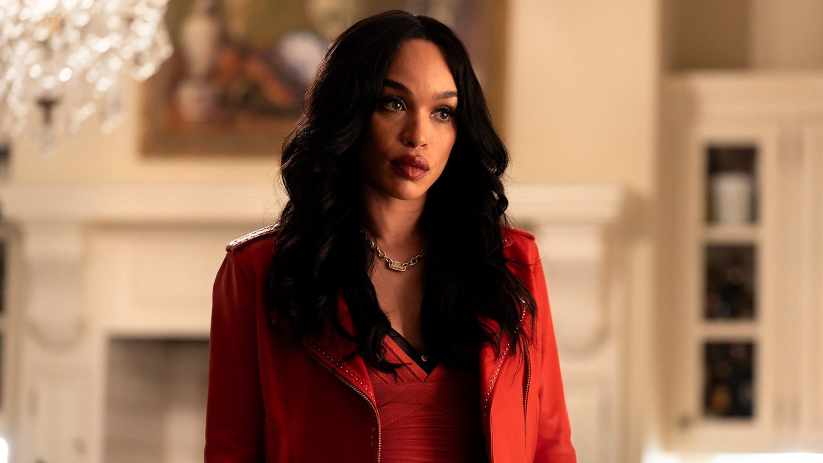 Cleopatra Coleman as V. Stiviano in a red jacket in Clipped episode 1