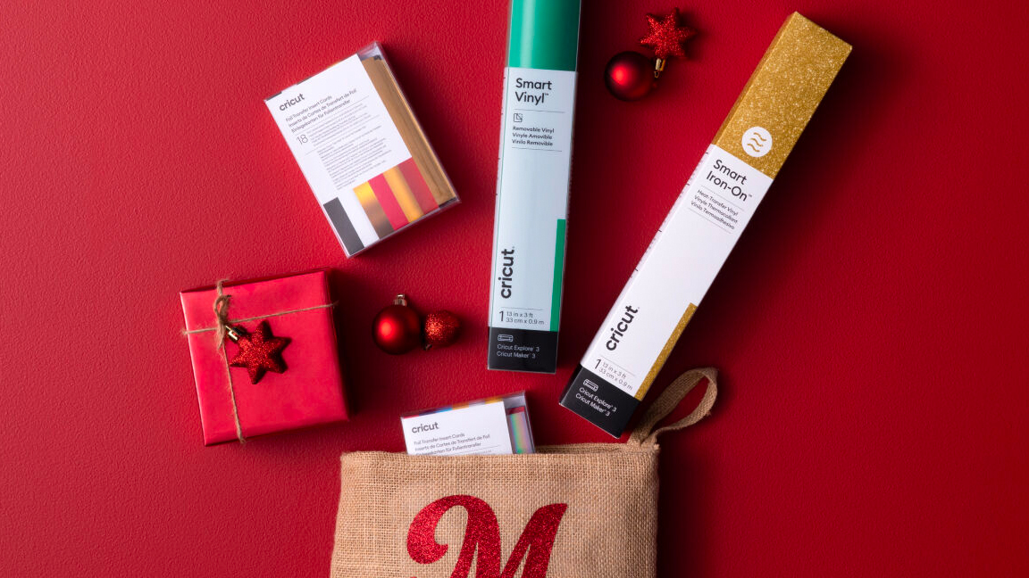 Cricut materials on a red Christmas background