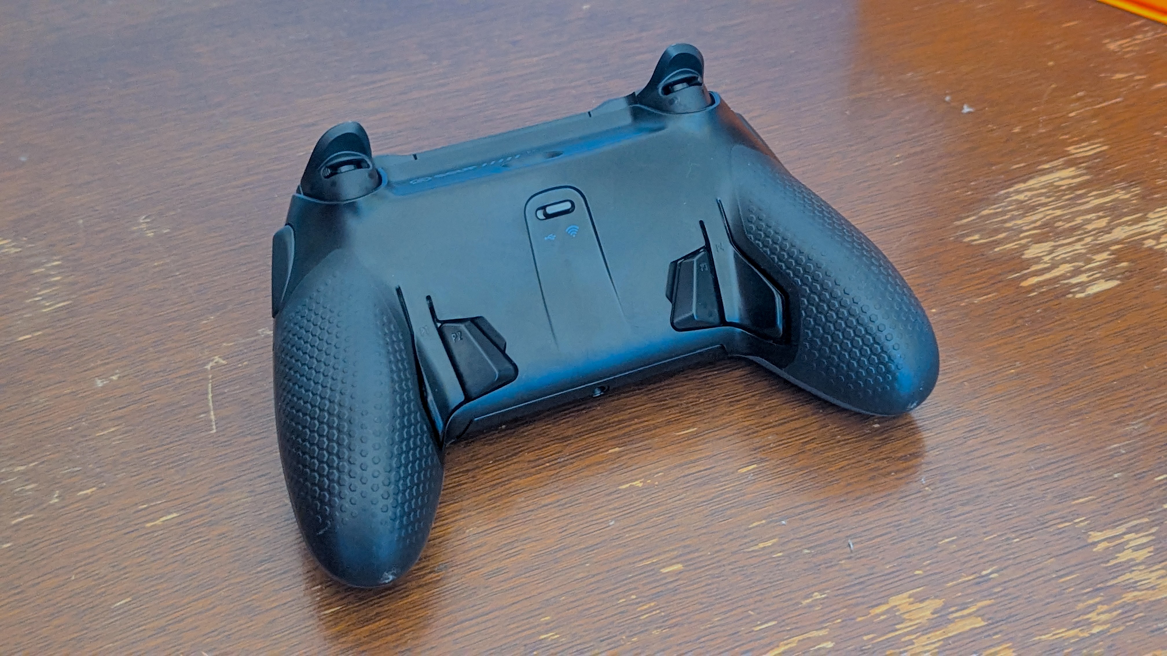 Scuf Envision Pro controller face down, showing back paddles