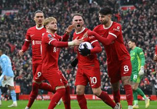 Jamie Carragher: Alexis Mac Allister celebrates with his Liverpool team-mates after scoring against Manchester City in March 2024.