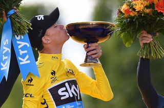Chris Froome kisses his 2015 Tour de France trophy