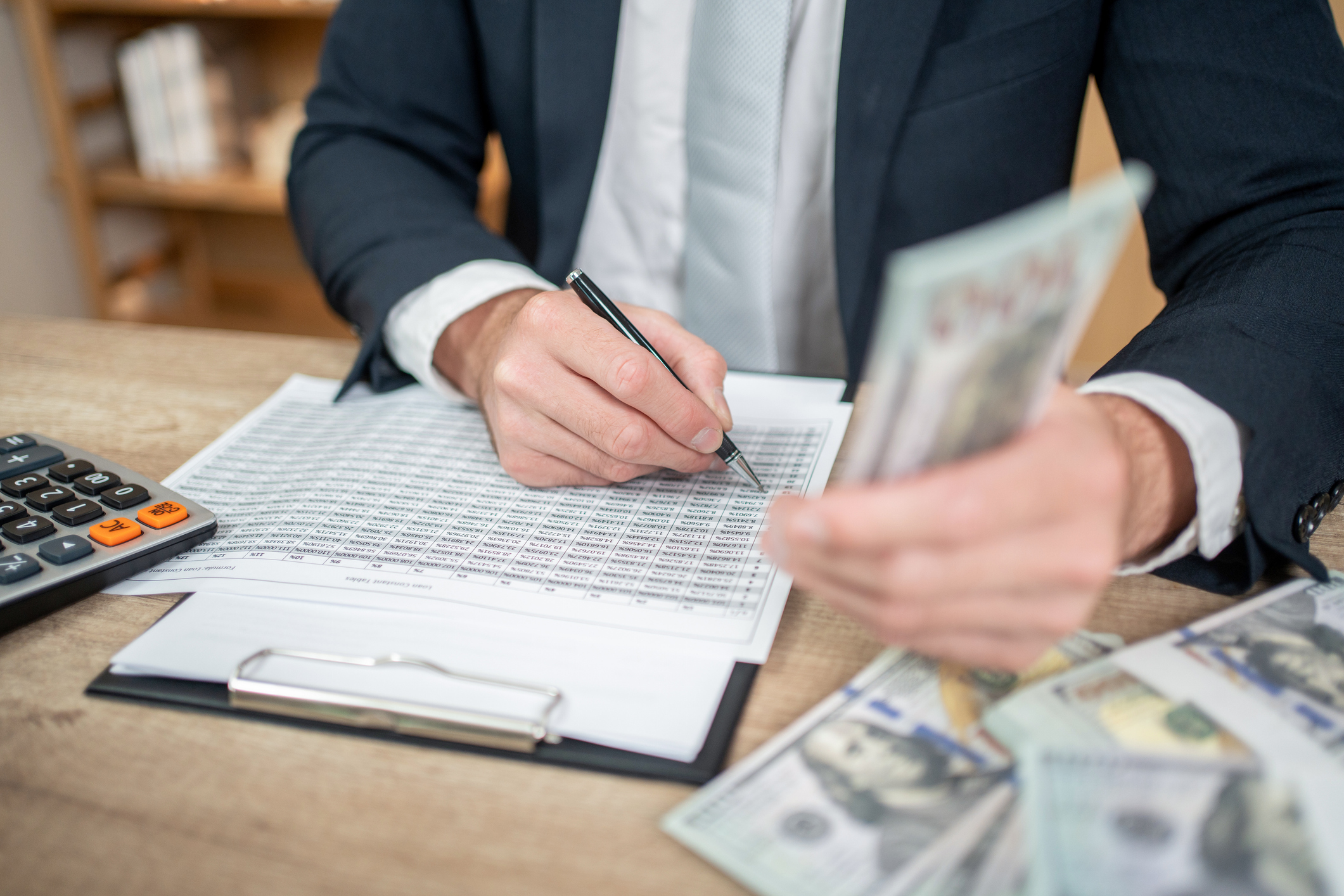A person calculating their taxes.