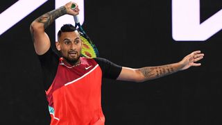 tennis Australia's Nick Kyrgios hits a return at the Australian Open 2022