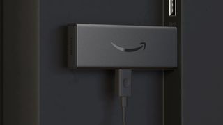 Amazon Fire TV Stick Lite plugged into TV