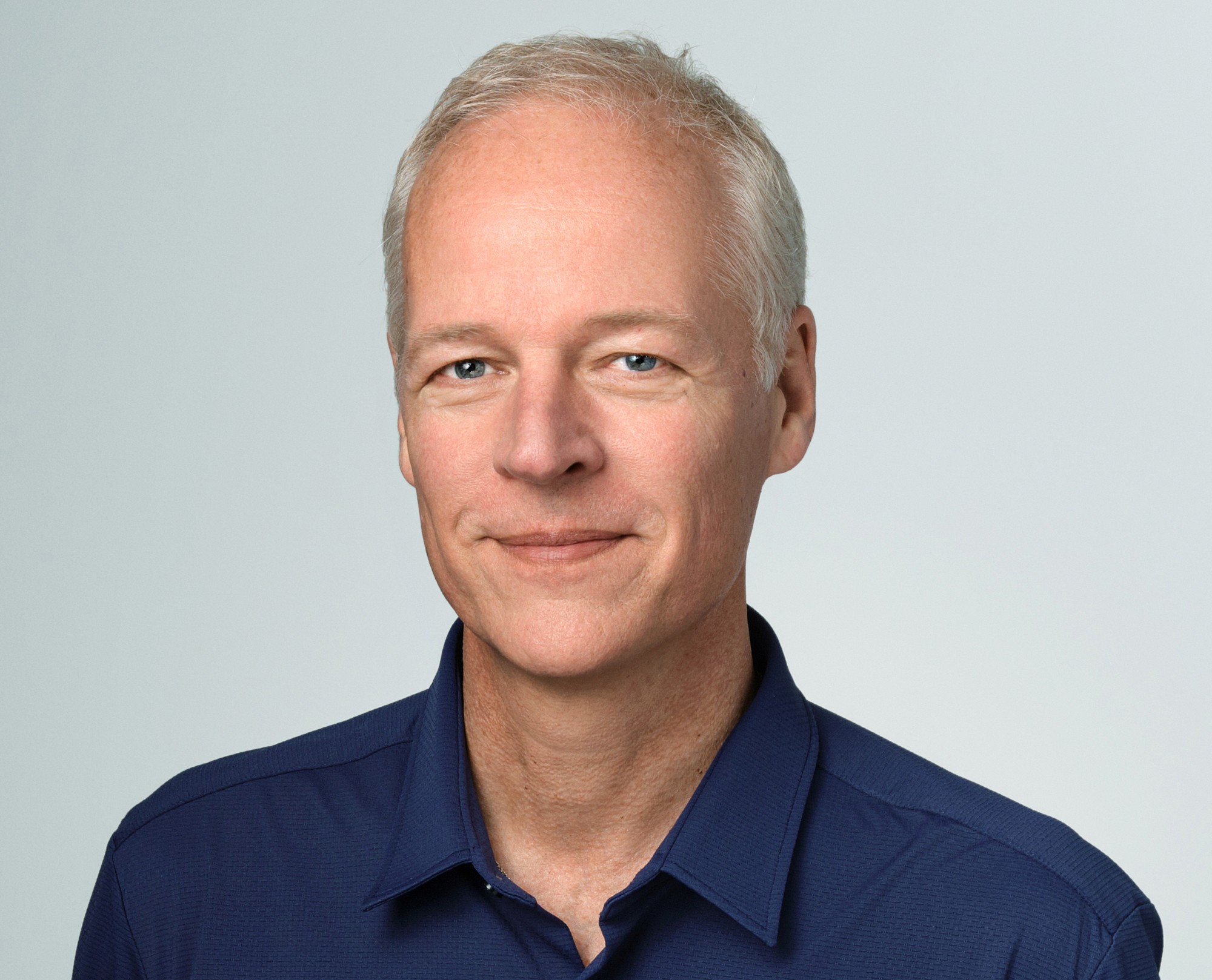 Dave Bernath silver haired fit man in a blue shirt
