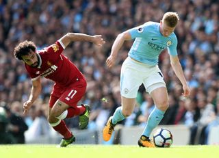 Liverpool’s Mohamed Salah (left) and Manchester City’s Kevin De Bruyne battle for the ball during the Premier League match at the Etihad Stadium, Manchester