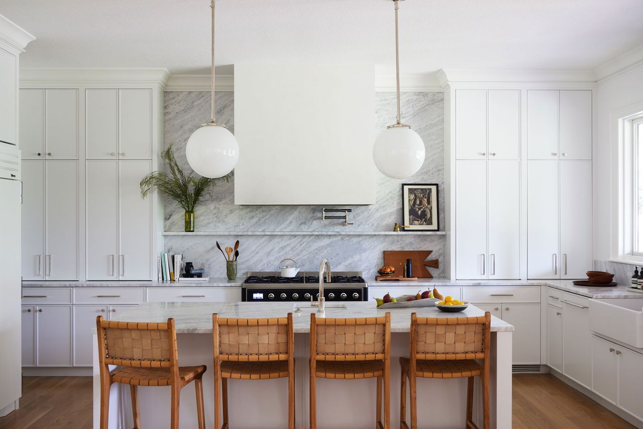 a white slim line shaker kitchen with an island