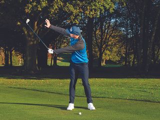 Adam Harnett demonstrating a reach drill in the backswing to prevent a chunk with a wedge