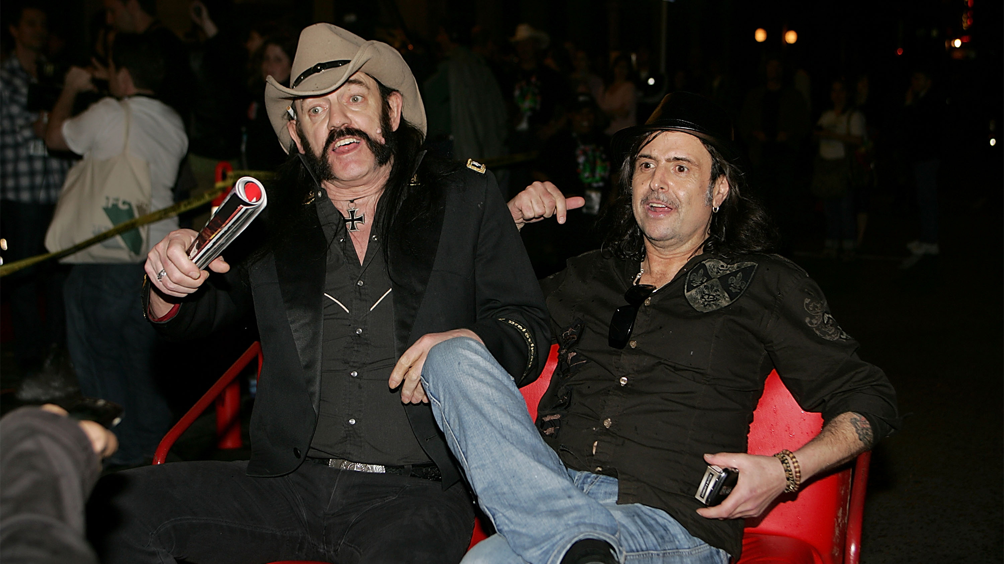 Lemmy Kilmister and Phil Campbell of Motorhead leave in a pedicab after a screening of "Lemmy" at the Paramount Theater during the South By Southwest Film Festival on March 15, 2010 in Austin, Texas.  