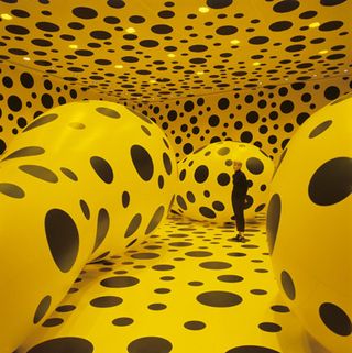 Installation at the Rice Gallery. The gallery is all yellow with black dots everywhere.