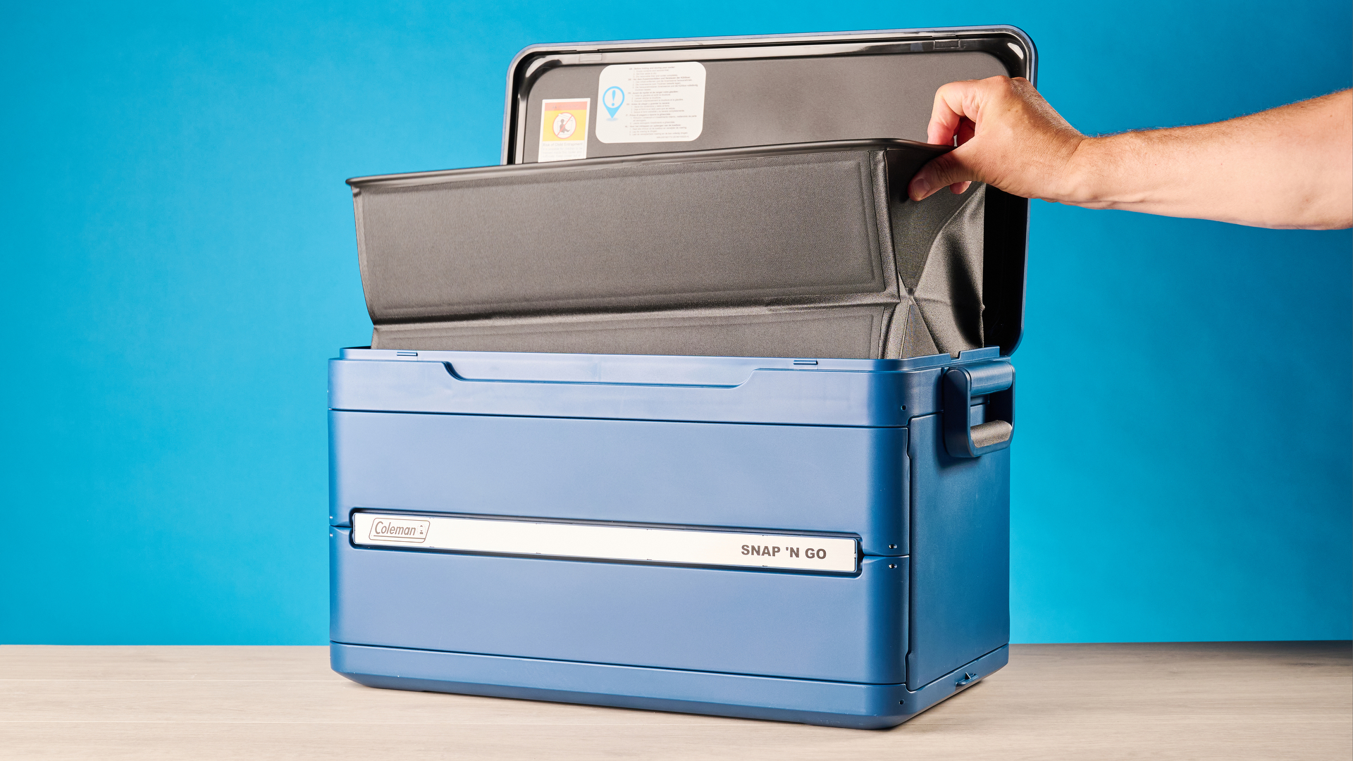 the coleman snap 'n go collapsible cooler photographed with the blue tom's guide background
