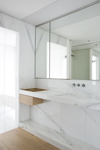 White Carrara marble is used in the en suite bathrooms