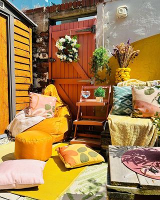 Outdoor patio with yellow walls and furniture