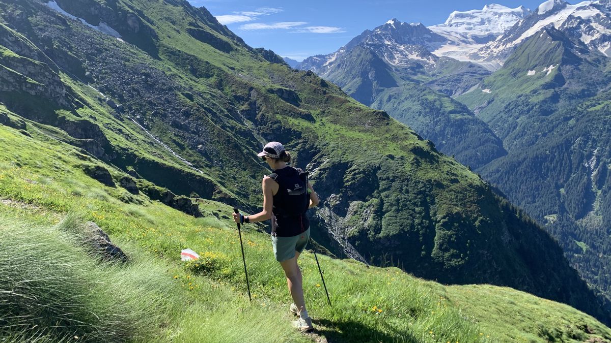 A woman trail running in the Swiss Alps