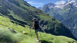 A woman trail running in the Swiss Alps