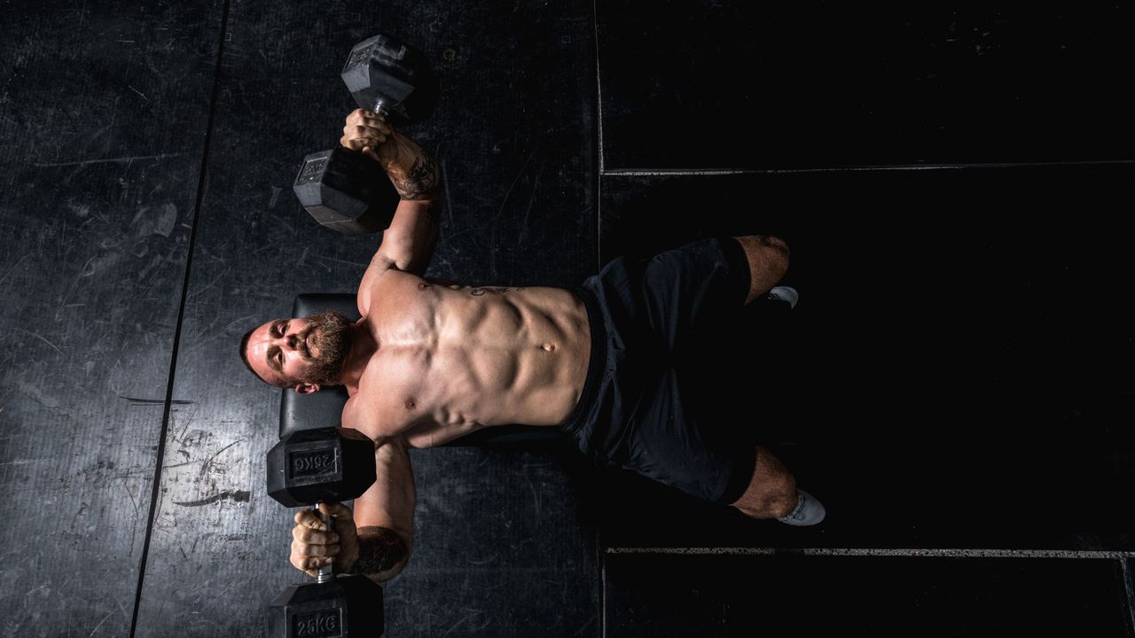 Man doing dumbbell chest press