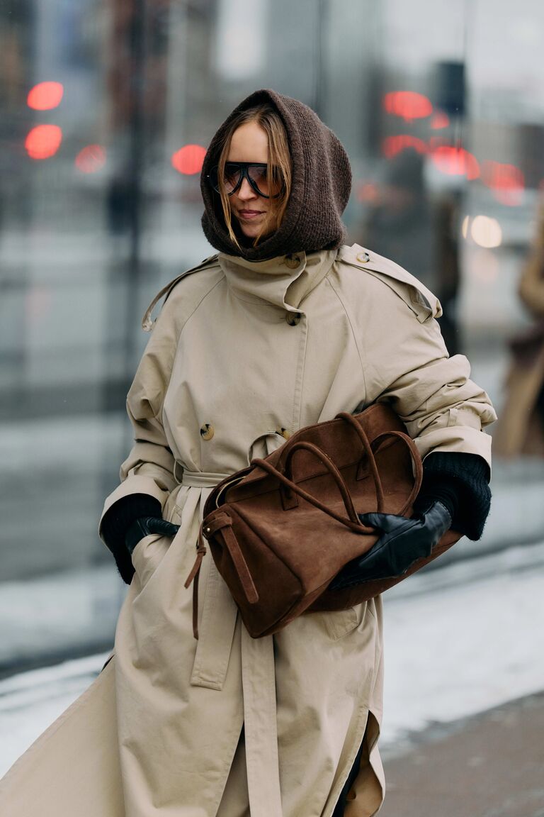 Photo of woman wearing coat at Copenhagen Fashion Week.