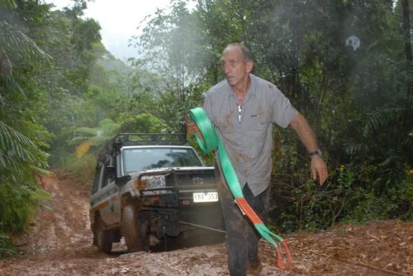 Organizer Gerhard Schoenbacher scrambles to extract a stuck truck